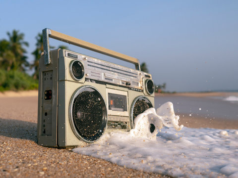 Tape recorder in sea foam and waves.