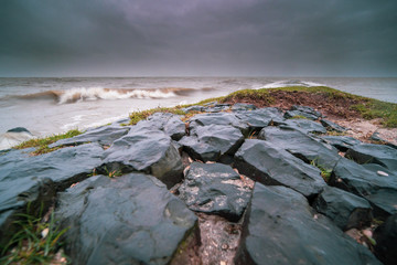 Storm on the Dutch coast with breaking waves on the shore