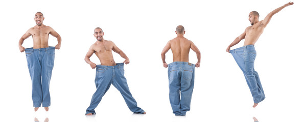 Obraz premium Man in dieting concept with oversized jeans