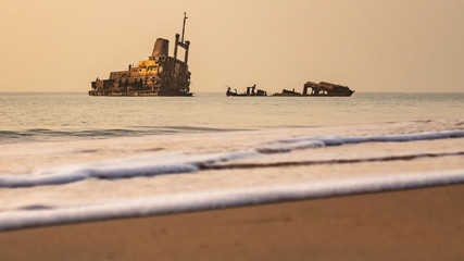 Beach Sunset with abandoned shipwreck