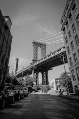 View from the street of the Manhattan Bridge in black and white
