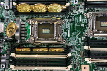 Golden Bitcoin Cryptocurrency on computer circuit board. Blockchain and security concept