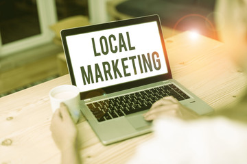 Conceptual hand writing showing Local Marketing. Concept meaning targets customers by finely...