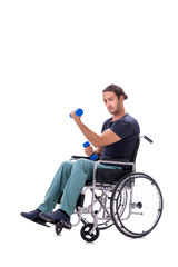 Obraz premium Young disabled man doing physical exercises isolated on white