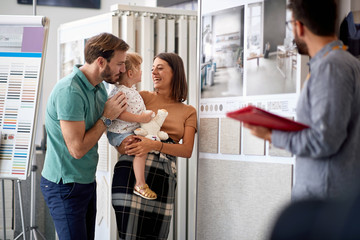 Family furnishing the house. couple choosing household in furniture store.