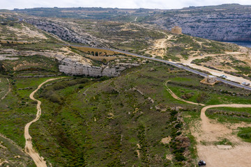 Aerial drone view of rocky coastline and sea. Blue hole and the collapsed Azure window in Dwejra...