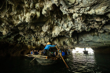 Tourist at the Luon Cave of Halong Bay in Vietnam