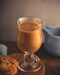 Coffee break composition with glass coffee with milk. Copy space. Toned photo