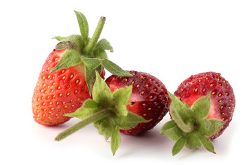 Three strawberries isolated on white