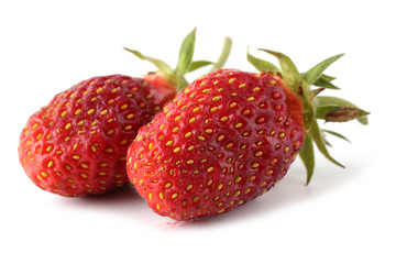Two strawberries isolated on white