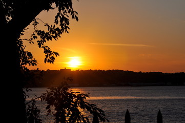 Sunset with leaves on the left