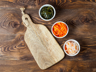Set of salads on wooden background.