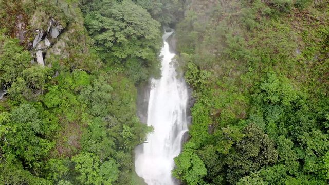  video with drone of beautiful waterfall in a forest or green mountain