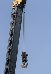 Hydraulic telescopic crane boom with hook.