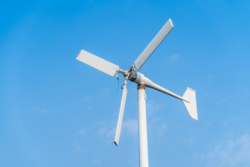 wind turbine against blue sky