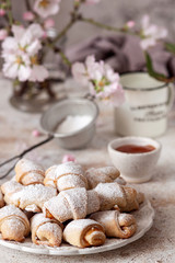 Fototapeta na wymiar Shortbread rolled cookies filled with apricot jam