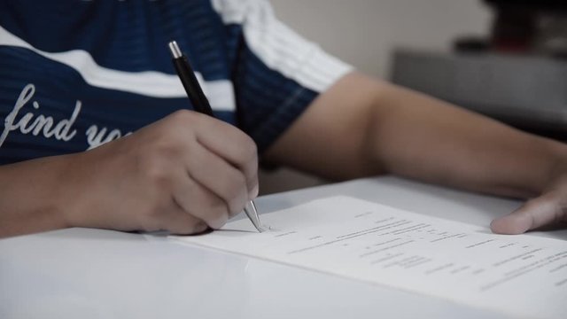 Closeup of signing a contract