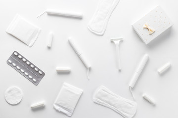 Tampons, feminine sanitary pads on a white background. Hygienic care on critical days. menstrual cycle. Caring for women's health. Monthly protection. Flat lay, top view, copy space