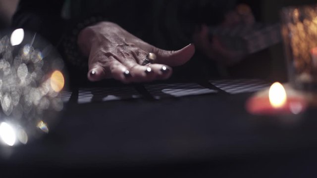 Close-up of the hand of an unknown witch woman