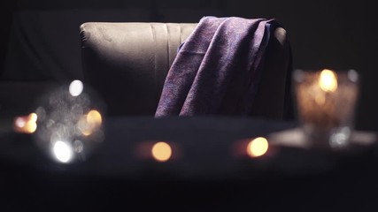 Close-up of an empty magician's chair with a mantle