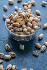 Roasted And Salted Pistachios In Glass Bowl