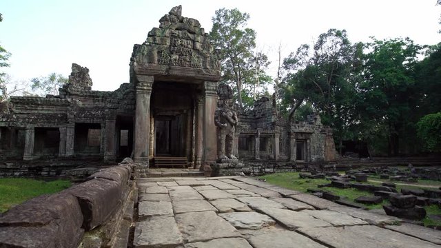 4K, Entrance door to Preah Khan temple. Gate with one guard sculpture. Ancient monument ruins in Angkor Thom Cambodia. Religious architecture landmarks buildings near Siem Reap. Khmer empire. -Dan