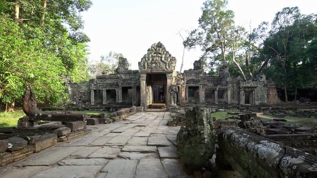 4K, Entrance door to Preah Khan temple. Gate with one guard sculpture. Ancient monument ruins in Angkor Thom Cambodia. Religious architecture landmarks buildings near Siem Reap. Khmer empire. -Dan
