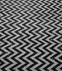 White and black zigzag pebble pavement; cobblestone street; decorative Greek mosaic pebble floor in...