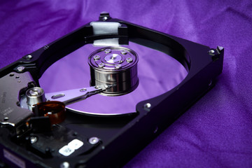 Opened hard drive from the computer hdd disk drive with mirror effects. Disassembled hard drive...
