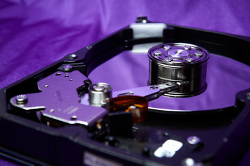 Opened hard drive from the computer hdd disk drive with mirror effects. Disassembled hard drive...