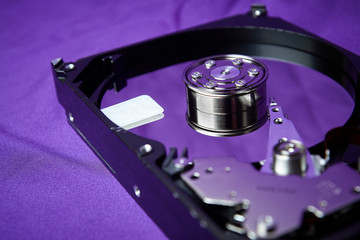 Opened hard drive from the computer hdd disk drive with mirror effects. Disassembled hard drive...
