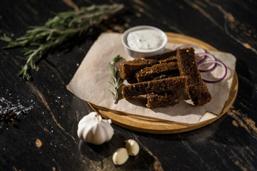 plate tray of fried garlic rye bread croutons