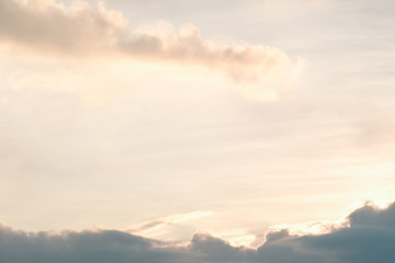 Obraz premium Dramatic soft orange sky and clouds when sunset