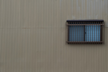 Obraz na płótnie Canvas grayscale zinc wall with window background