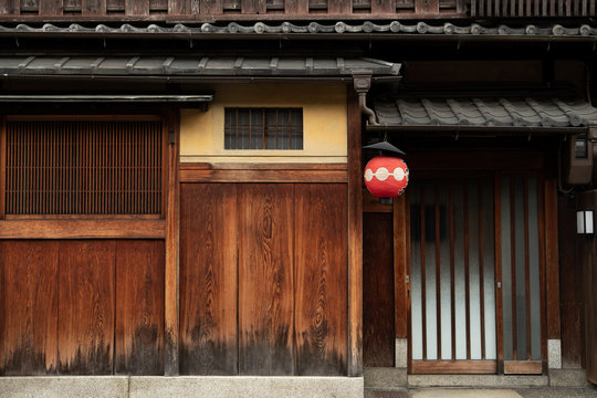 wooden wall of window and old house in Japan. low key and soft focus.