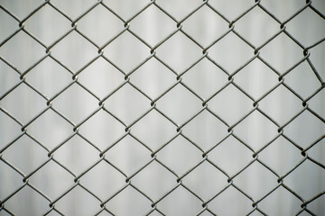 Close-up chain link fence , Sunset background