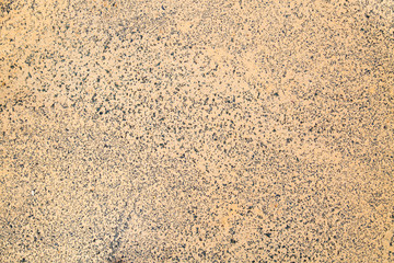 Background of blue rubber coating with yellow sand intended for children's and sports grounds, texture structure design.