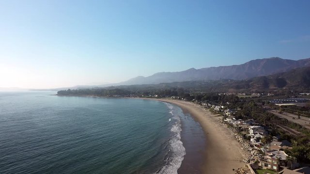 Santa Barbra's calm, beautiful coastline houses, drone establishing shot