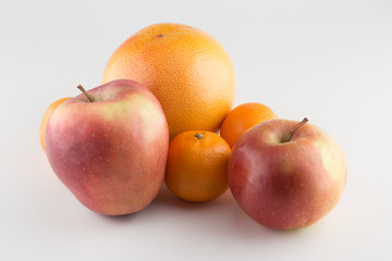 Fototapeta na wymiar Apples and Orange Isolated on a White Background