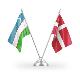 Denmark and Uzbekistan table flags isolated on white 3D rendering