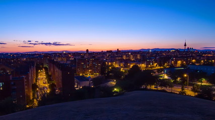 Fototapeta na wymiar Panoramic day to night timelapse View of Madrid, Spain. Photo taken from the hills of Tio Pio Park, Vallecas-Neighborhood.