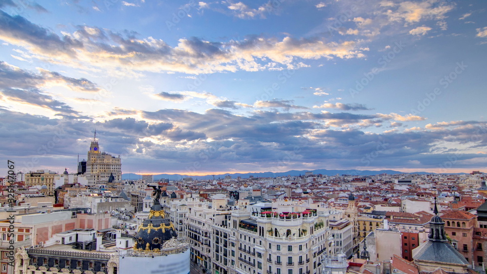 Wall mural panoramic aerial view of gran via timelapse at sunset, skyline old town cityscape, metropolis buildi