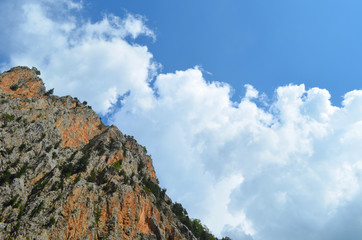 The top of the mountain on the side of the blue sky with clouds. Nature of Turkey, the Mediterranean
