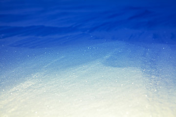 winter background with blue and white tone of the snow 