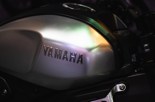 Close up of YAMAHA logo on the motorcycle body. YAMAHA is one of the famous motorcycle manufacturers in the world. Yamaha Motor Company is a Japanese manufacture