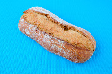 Loaf of bread with blue background