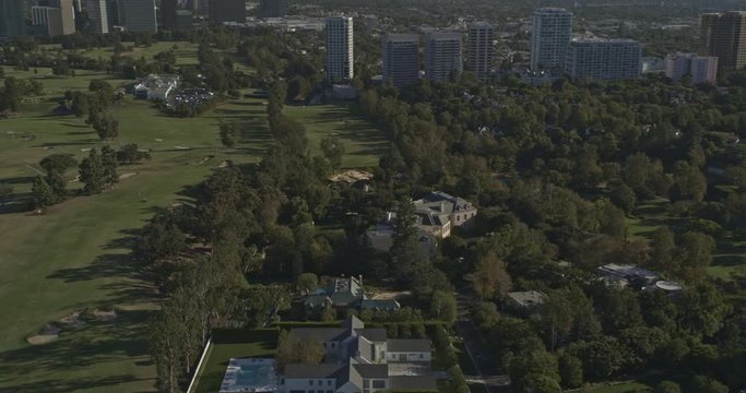 Los Angeles Aerial v207 Panning birdseye, low to high looking above Holmby Hills mansions to Century City cityscape - October 2019