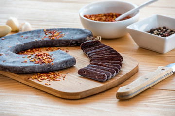  Cut Slices of Special Pirot horseshoe ironed sausage - Peglana Pirotska kobasica, made from veal, sheep and goat meat, with addition of garlic, mixed pepper, Crushed dried chili peppers and spices
