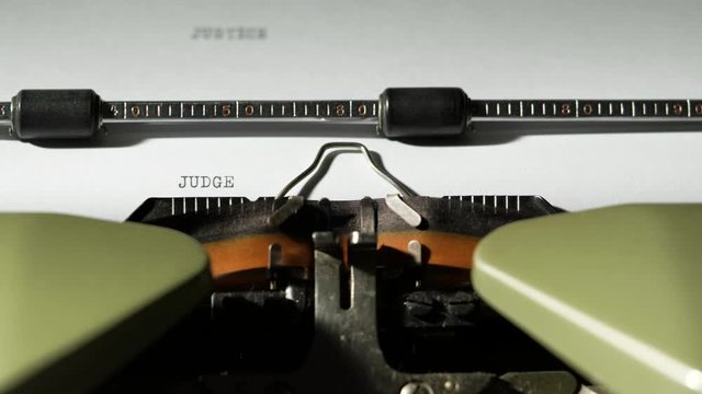 JUDGE written on old green vintage retro typewriter