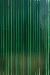 green shiny shutter metal wall background with text space